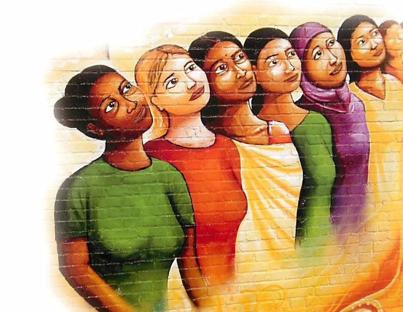 Mural of women standing together and looking up